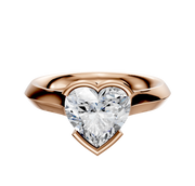 An 18K rose gold engagement ring with a bezel half bezel east/west cathedral knife edge 3.0mm band is showcased against a plain white background.