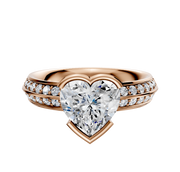 The 14K Rose Gold Bezel Half Bezel East/West Classic Knife Edge engagement ring features a 2.5mm band with a single row of pave diamonds for classic elegance.