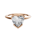 A 14K rose gold bezel half bezel east/west classic knife edge 1.5mm engagement ring with a large heart-shaped diamond solitaire, showcased on a plain white background.