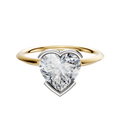 An 18K two tone bezel half bezel east/west classic knife edge 1.5mm engagement ring displayed on a plain white background.