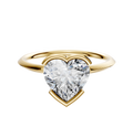 An 18K yellow gold bezel half bezel east/west classic knife edge 1.5mm engagement ring is showcased against a plain white background.