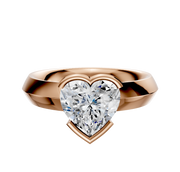 The 18K Rose Gold Bezel Half Bezel East/West Classic Knife Edge 4.0mm Engagement Ring features a prominent center stone and is displayed against a plain white background.