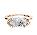A 14K rose gold bezel half bezel engagement ring features a 1.5mm cathedral dome band and an east/west-set stone, shown against a plain white background.
