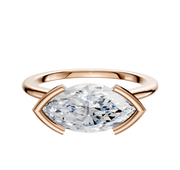 The 18K Rose Gold Bezel Half Bezel East/West Cathedral Dome 1.5mm Engagement Ring features a large, horizontally set marquise diamond between curved prongs, shown on a plain white background.