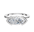 A 14K white gold bezel half bezel east/west cathedral dome 1.5mm engagement ring, featuring a large marquise-cut gemstone set horizontally, is shown against a plain white background.