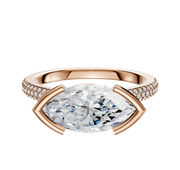 The 14K Rose Gold Bezel Half Bezel East/West Cathedral Dome 3-Row-Pave 2.0mm Engagement Ring features a central marquise diamond and sparkling round diamonds in three rows along the upper band.
