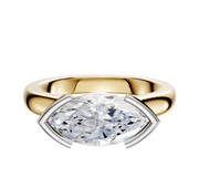 A 14K two-tone engagement ring featuring a 3.0mm dome with an East/West cathedral and half bezel setting, showcased against a plain white background.