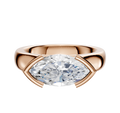 The 14K Rose Gold Bezel Half Bezel East/West Cathedral Dome 4.0mm Engagement Ring features a modern setting with polished metal framing a large, marquise-cut clear gemstone elegantly on two sides.