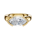 An 18K yellow gold East/West cathedral dome engagement ring with a 4.0mm marquise diamond in a minimalist half bezel, displayed on a plain white background.