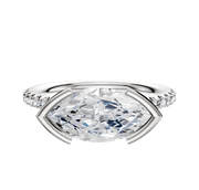 The 18K White Gold Bezel Half Bezel East/West Classic Dome 1-Row-Pave 2.5mm Engagement Ring features a center stone in an east/west setting with a row of small diamonds on the band, shown against a white background.