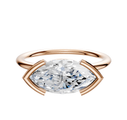 The 14K Rose Gold Bezel Half Bezel East/West Classic Dome 1.5mm Engagement Ring features a sleek, modern open setting with a marquise-cut diamond, showcased against a white background.