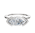 A 14K white gold East/West Classic Dome engagement ring with a 1.5mm band, featuring a large oval-cut white gemstone in a modern half bezel setting, displayed against a plain white background.