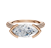 A 14K rose gold engagement ring featuring a classic dome band, east/west bezel-set center stone, and three rows of 2.0mm pave diamonds.