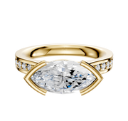 The 18K Yellow Gold Bezel Half Bezel East/West Cathedral Flat 1-Row-Pave 2.5mm Engagement Ring features a unique east/west setting and a row of pave diamonds along the band, crafted in luxurious yellow gold.
