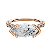The 18K Rose Gold Bezel Half Bezel East/West Cathedral Flat 3-Row-Pave 2.0mm Engagement Ring features a striking marquise-cut center diamond and sparkling round diamonds along the band’s shoulders, shown against a plain white background.