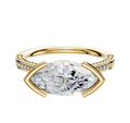 An 18K yellow gold engagement ring features an east/west cathedral setting with a central stone and 3-row pave diamonds along the flat band, shown on a plain white background.
