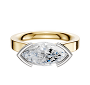 The 14K Two Tone Bezel Half Bezel East/West Cathedral Flat 3.0mm Engagement Ring is showcased against a plain white background, featuring a sleek design that highlights its distinctive setting.