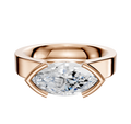 The 14K Rose Gold Bezel Half Bezel East/West Cathedral Flat 4.0mm Engagement Ring features a modern, wide band with a horizontally-set marquise diamond, shown against a white background.