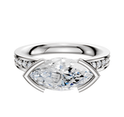 The 14K White Gold Bezel Half Bezel East/West Classic Flat 1-Row-Pave 2.5mm Engagement Ring features a sleek east-west set center stone with a half bezel and a single row of sparkling pave-set diamonds along the band.