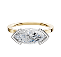 The 14K Two Tone Bezel Half Bezel East/West Classic Flat 1.5mm Engagement Ring features a modern marquise diamond in a geometric setting, displayed against a plain white background.