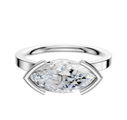 An 18K White Gold Bezel Half Bezel East/West Classic Flat 2.0mm Engagement Ring with a large horizontally set clear gemstone in a modern setting, displayed against a plain white background.
