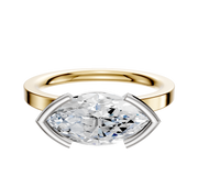 The 14K Two Tone Bezel Half Bezel East/West Classic Flat 2.0mm Engagement Ring showcases a modern, elegant style with a gold band and horizontally set marquise-cut diamond in a white metal bezel, blending yellow gold and white metal.