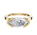The 14K Yellow Gold Bezel Half Bezel East/West Classic Flat 2.0mm Engagement Ring features a large marquise-cut diamond in a modern setting with gold prongs securing the gemstone, shown on a plain white background.