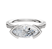 The Platinum Bezel Half Bezel East/West Classic Flat 3-Row-Pave 2.0mm Engagement Ring features a modern east/west bezel-set center, accented by three rows of pavé diamonds along the upper band for extra sparkle.