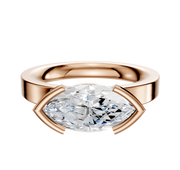 The 14K Rose Gold Bezel Half Bezel East/West Classic Flat 3.0mm Engagement Ring features a large, horizontally set marquise-cut diamond in a modern open bezel setting, shown on a plain white background.