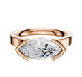 The 18K Rose Gold Bezel Half Bezel East/West Classic Flat 3.0mm Engagement Ring features a horizontally set marquise diamond in a modern, sleek bezel setting against a plain white background.