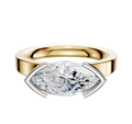 A 14K Two Tone Bezel Half Bezel East/West Classic Flat 3.0mm Engagement Ring displayed on a plain white background, featuring a modern design with gold and white metal accents.