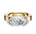 A 18K two-tone bezel half-bezel East/West classic flat 4.0mm engagement ring featuring a wide band and a large marquise-cut diamond set horizontally in a modern prong setting.