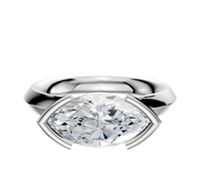 A 14K white gold bezel half bezel east/west cathedral knife edge 3.0mm engagement ring is set against a plain white background.