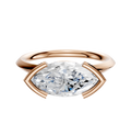 The 14K Rose Gold Bezel Half Bezel East/West Classic Knife Edge 2.0mm Engagement Ring showcases a large, horizontally set marquise diamond in a modern, minimalist bezel setting against a white background.