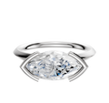 An 18K white gold Bezel Half Bezel East/West Classic Knife Edge 2.0mm engagement ring with a large marquise-cut clear gemstone is displayed on a plain white background.