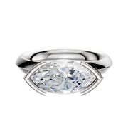 A 14K white gold engagement ring with a classic knife edge and half bezel east/west setting, shown against a plain white background.