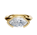 An 18K yellow gold East/West Classic Knife Edge engagement ring featuring a 3.0mm marquise diamond in a modern half bezel setting, shown against a plain white background.