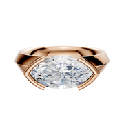 The 18K Rose Gold Bezel Half Bezel East/West Classic Knife Edge 4.0mm Engagement Ring features a striking design, shown against a plain white background.