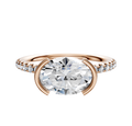 The 18K Rose Gold Bezel Half Bezel East/West Classic Dome 1-Row-Pave 2.5mm Engagement Ring features a modern half-bezel setting with a round center diamond and small accent diamonds along the band.