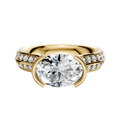 An 18K yellow gold Cathedral Knife Edge engagement ring with a round center stone and 1-row pave diamonds, displayed on a plain white background.