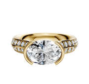 An 18K yellow gold Cathedral Knife Edge engagement ring with a round center stone and 1-row pave diamonds, displayed on a plain white background.