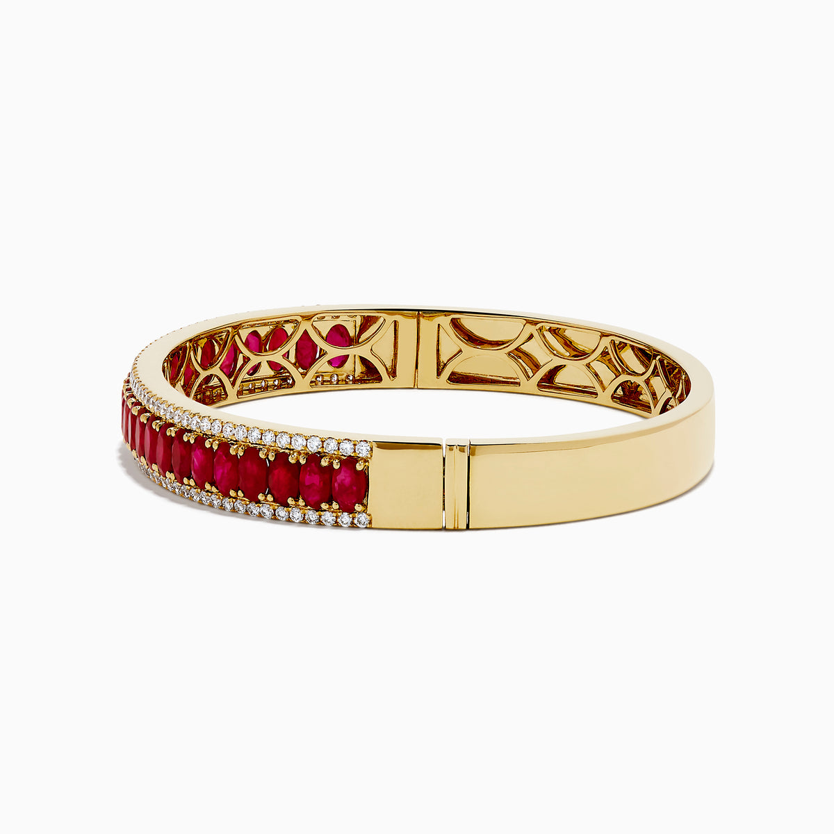 The 18K Yellow Gold Ruby and Diamond Bangle features a honeycomb-patterned interior, with a row of rubies bordered by two rows of sparkling diamonds on the outside.