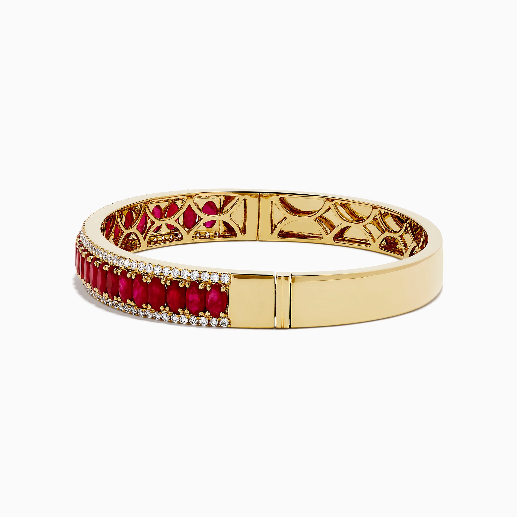 The 18K Yellow Gold Ruby and Diamond Bangle features a honeycomb-patterned interior, with a row of rubies bordered by two rows of sparkling diamonds on the outside.