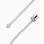The 18K Two Tone Gold Yellow and White Diamond Bracelet features alternating round white stones and three central yellow diamond clusters, each encircled by white diamonds, secured with a reliable clasp.