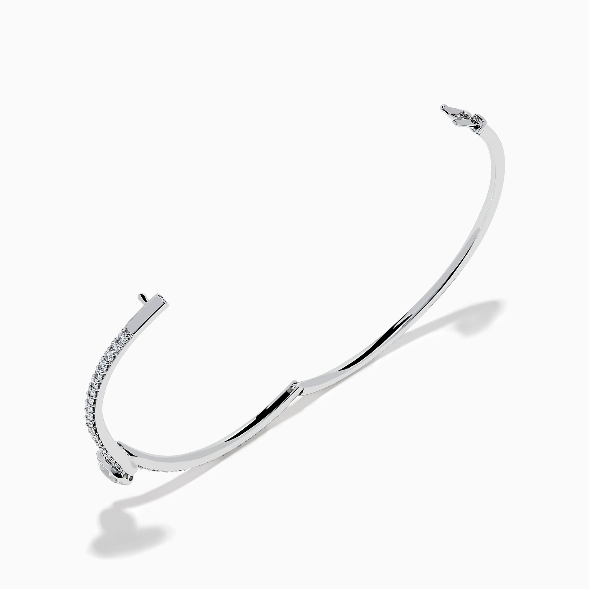 The Star Lab Grown Diamond Connect Bangle in 18K White Gold features a central round lab-grown diamond and a band set with small diamonds, all in an elegantly curved design, displayed on a white background.
