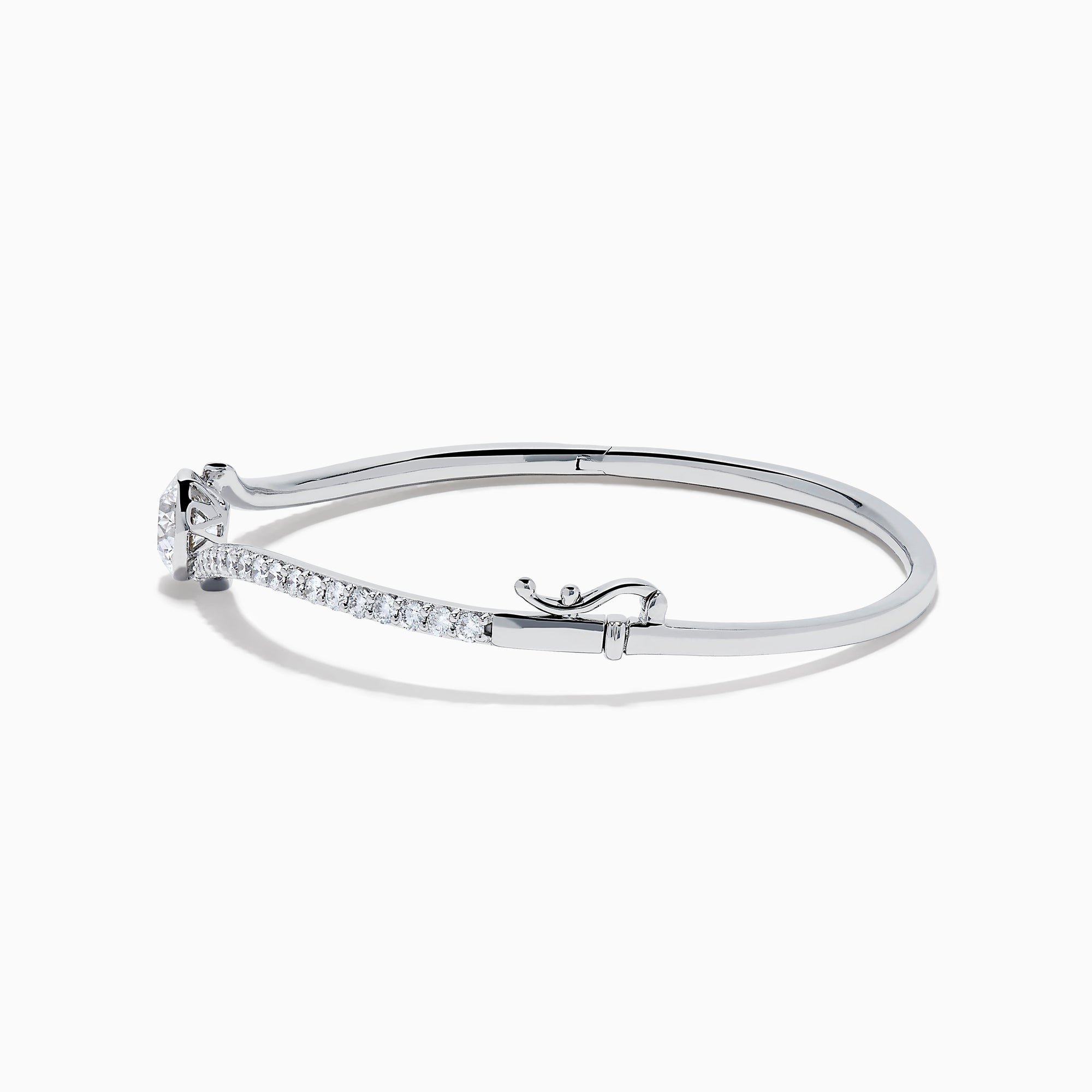 The Star Lab Grown Diamond Connect Bangle in 18K White Gold features a central round lab-grown diamond and a band set with small diamonds, all in an elegantly curved design, displayed on a white background.