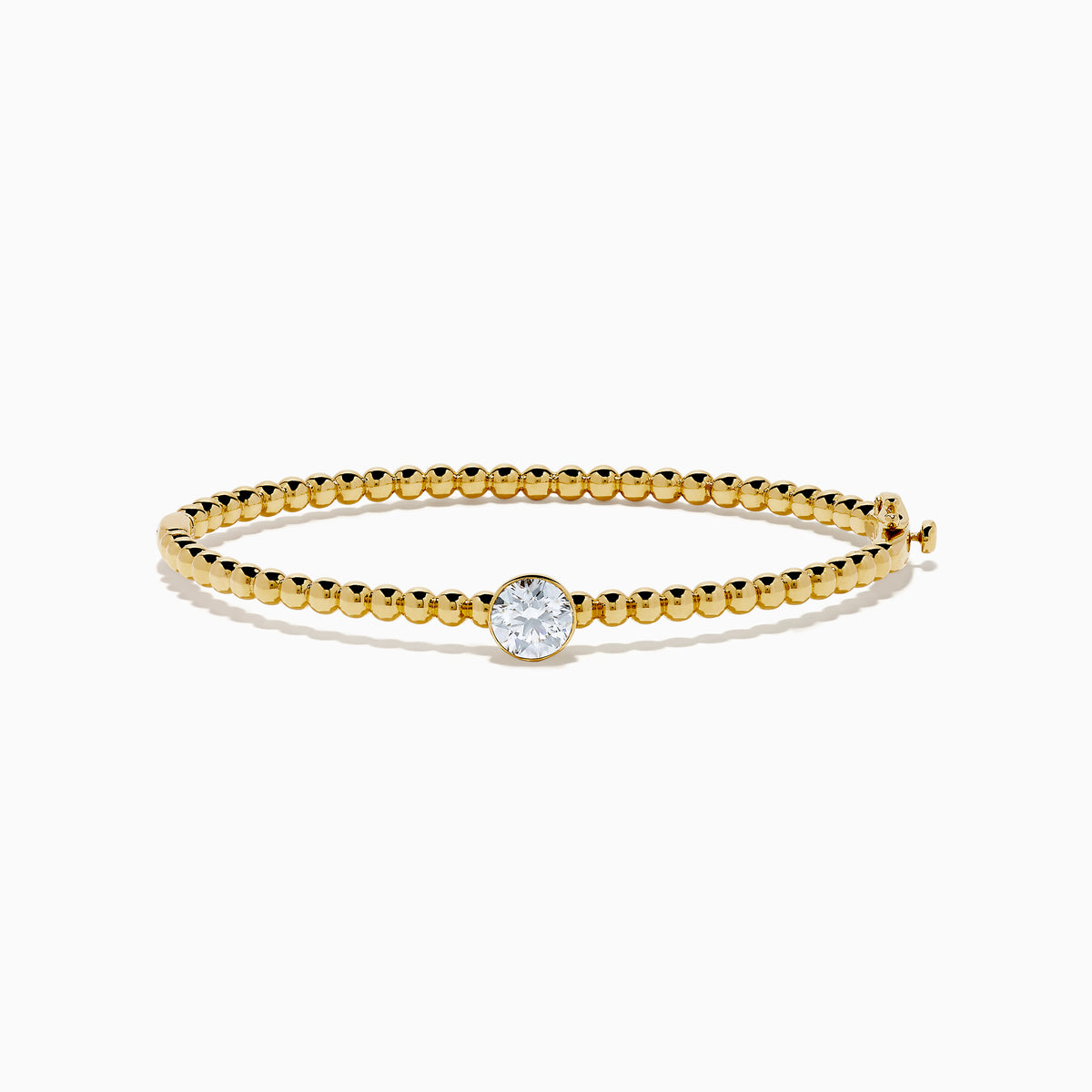 The Star Lab Grown Diamond Beaded Bangle in 18K Yellow Gold features a delicate gold band with beaded accents and a single round, clear lab-grown diamond at the center, shown against a plain white background.