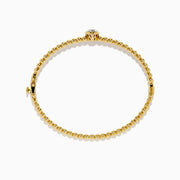 The Star Lab Grown Diamond Beaded Bangle in 18K Yellow Gold features a delicate gold band with beaded accents and a single round, clear lab-grown diamond at the center, shown against a plain white background.