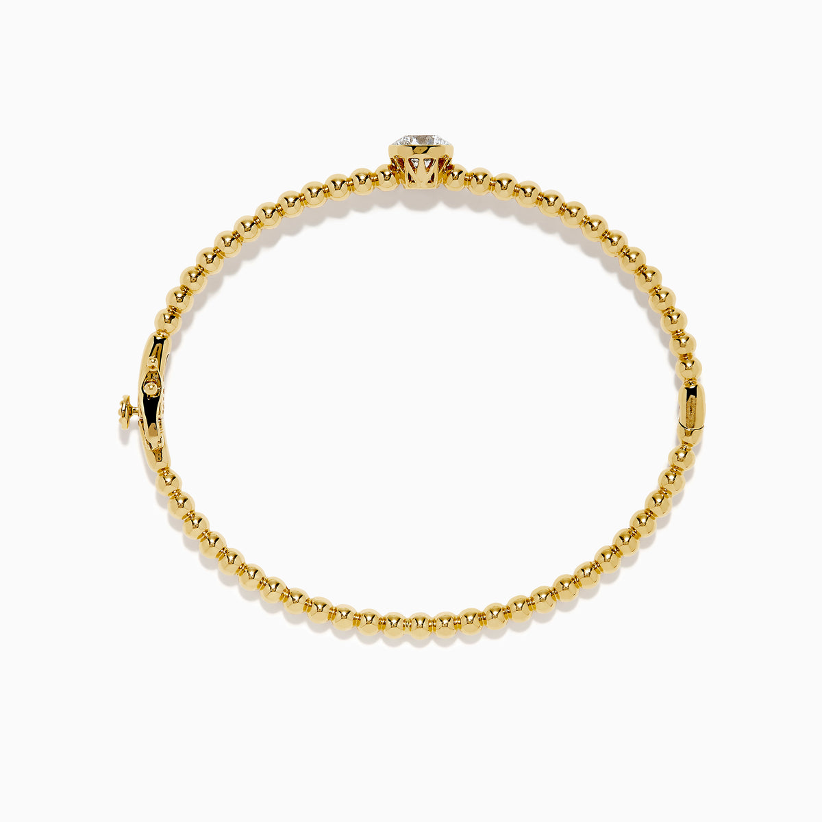 The Star Lab Grown Diamond Beaded Bangle in 18K Yellow Gold features a delicate gold band with beaded accents and a single round, clear lab-grown diamond at the center, shown against a plain white background.
