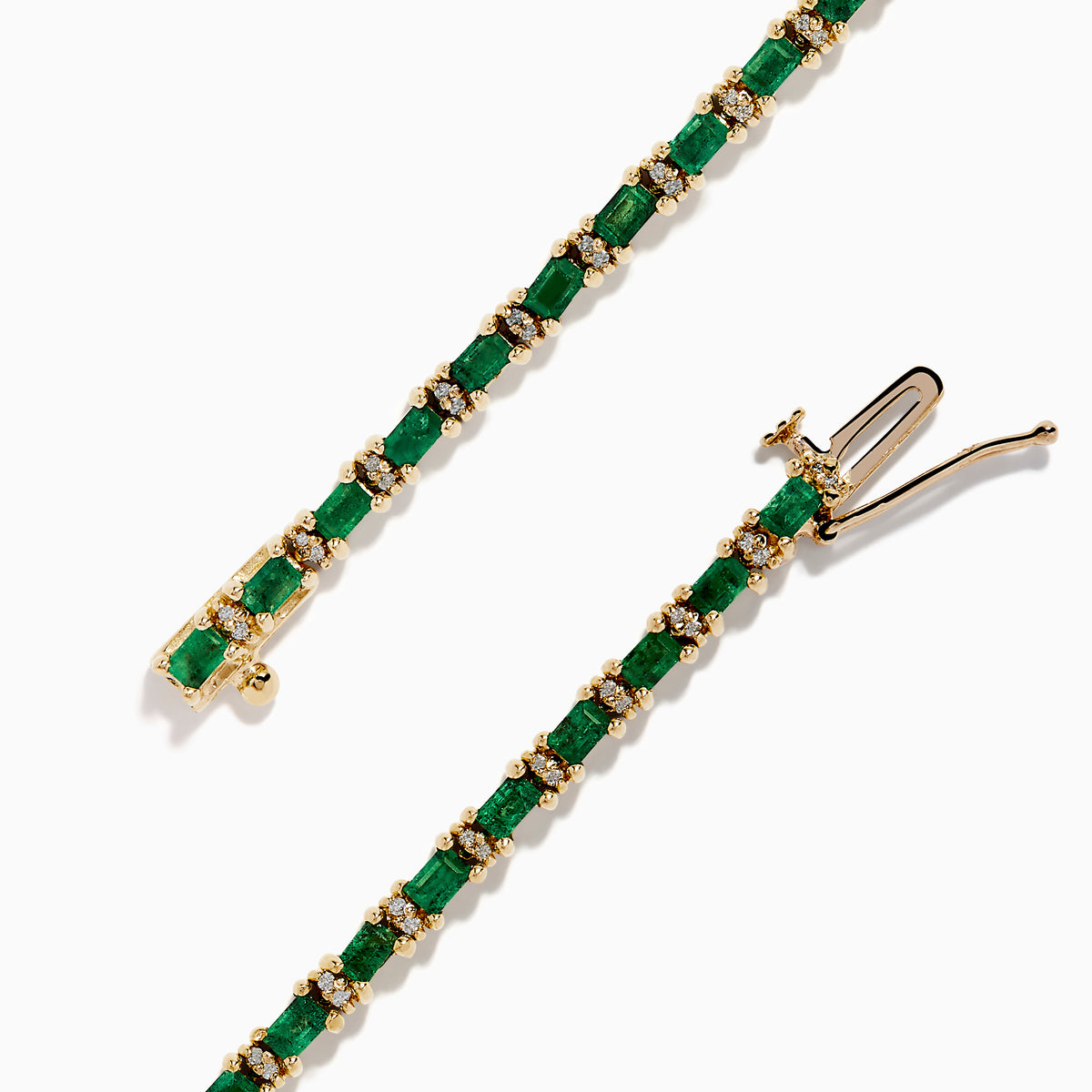 The Brasilica 14K Yellow Gold Emerald and Diamond Tennis Bracelet features a row of green emeralds and sparkling diamonds set in yellow gold prongs, shown against a plain white background.